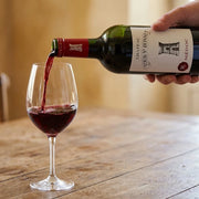 2016 Chateau Tour St. Bonnet - Medoc (750ml) | This wine being poured into a wine glass.