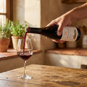 2022 Casar de Burbia - Mencia (750ml) | Create an ultra-photorealistic commercial image featuring the uploaded 2022 Casar de Burbia - Mencia (750ml) as the hero product, using the provided photo as th