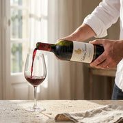 2022 Chateau Giscours - Margaux (750ml) | Create an ultra-photorealistic commercial photograph featuring the uploaded 2022 Chateau Giscours - Margaux (750ml) from the provided image as the sole product