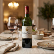 2022 Chateau Giscours - Margaux (750ml) | Create an ultra-photorealistic image featuring the uploaded 2022 Chateau Giscours - Margaux (750ml) in the provided image as the central subject, displayed on a