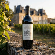 2023 Chateau Carmes Haut Brion - Pessac (750ml) | Create an ultra-photorealistic image featuring the uploaded 2023 Chateau Carmes Haut Brion - Pessac (750ml) as the central subject, using the provided product p