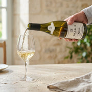 2023 Servin - Chablis (750ml) (PRE ARRIVAL) | Create an ultra-photorealistic commercial image featuring the uploaded 2023 Servin - Chablis (750ml) (PRE ARRIVAL) in the provided image as the sole product ref