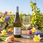 2024 Merlin Cherrier - Sancerre (750ml) | This wine being served in spring time with spring flowers in the scene.