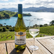 2025 Oyster Bay - Sauvignon Blanc Marlborough (750ml) | This wine with a wine glass overlooking oyster bay in new zealand